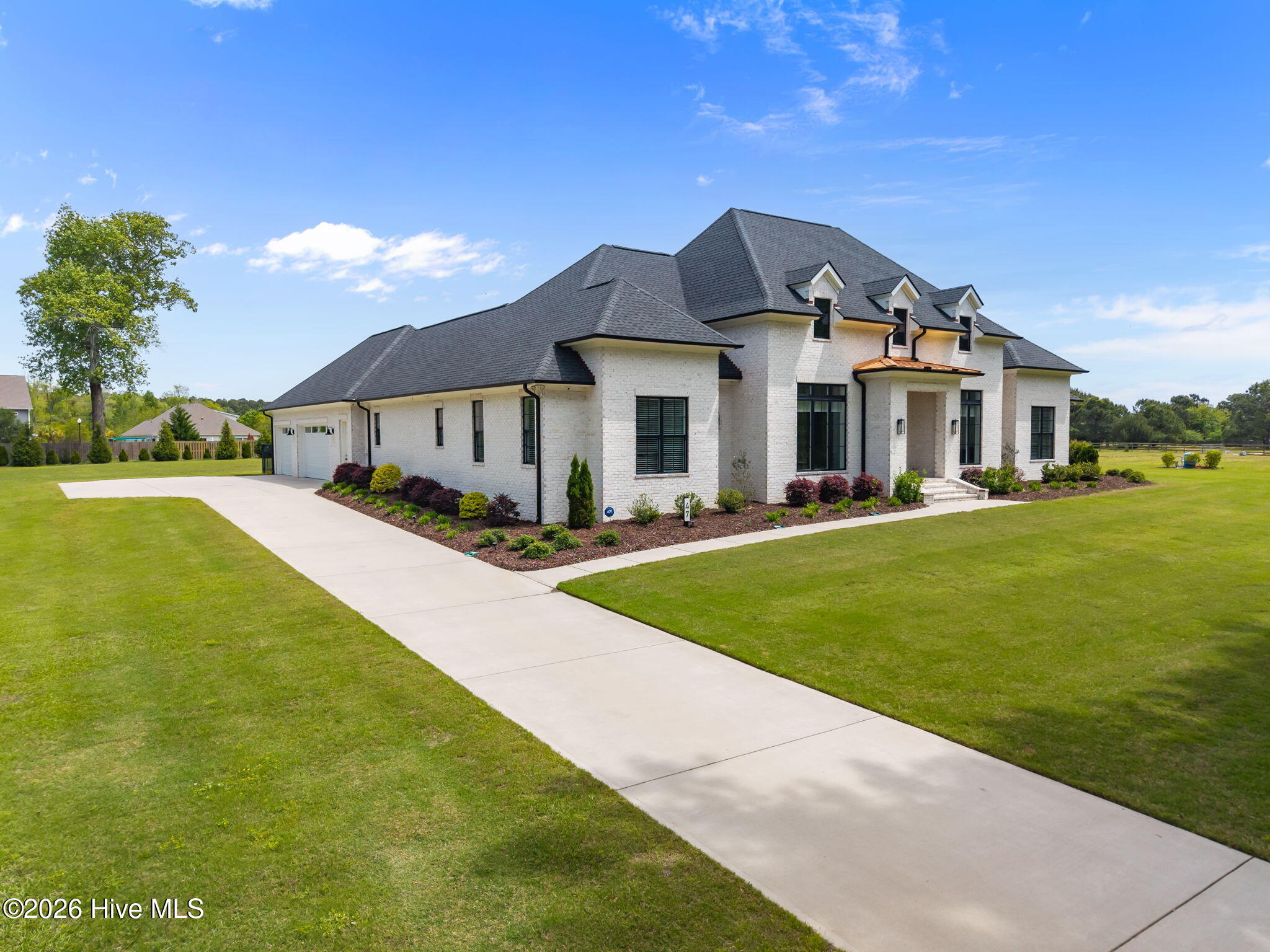 47 East Rolling Meadows Road Hampstead, NC 28443 - Photo 1 of 89 13-web-or-mls-DJI_20260413125046_0679_D