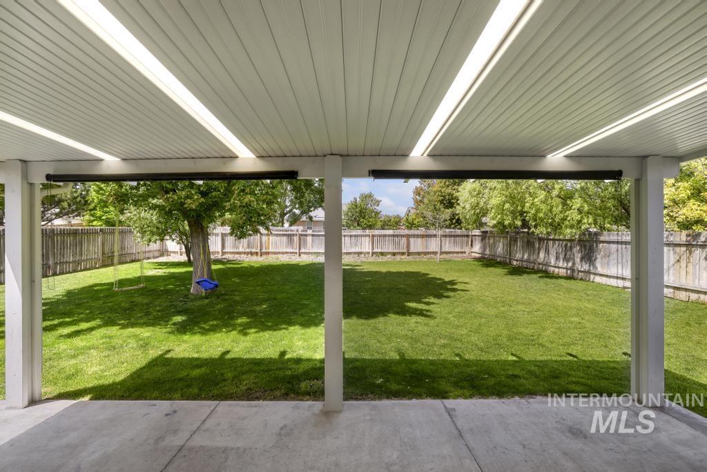 1183 Cortes Loop Twin Falls, ID 83301 - Photo 24 of 30 Covered patio with concrete flooring, framed by white structural posts and a paneled ceiling