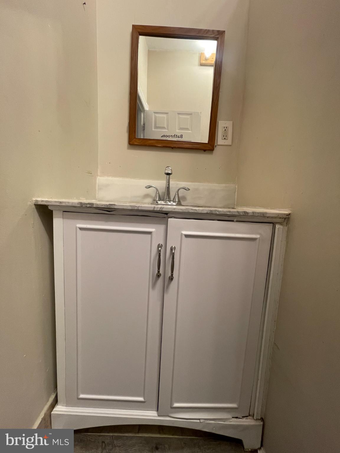 5410 Kingsessing Avenue Philadelphia, PA 19143 - Photo 14 of 17 Charming corner sink with elegant cabinetry.