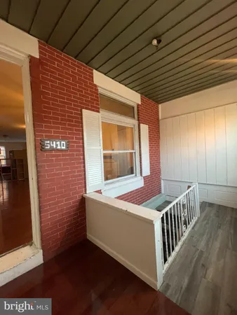 a front view of house with deck