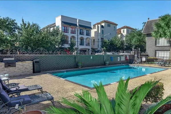 a view of backyard with outdoor seating and city view
