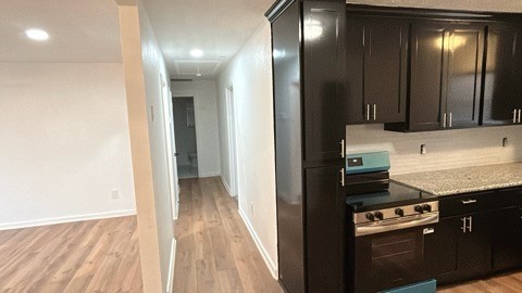 6330 Cobalt Street Houston, TX 77016 - Photo 11 of 29 a kitchen with a refrigerator stove and cabinets