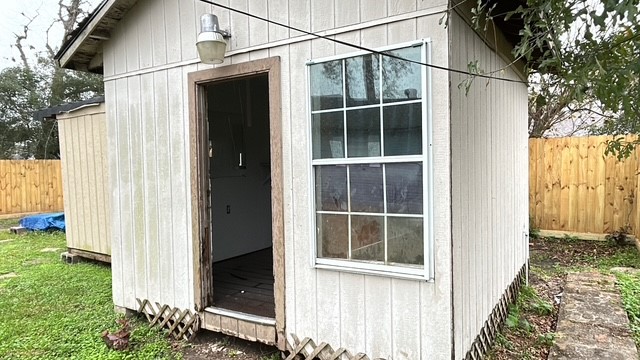 6330 Cobalt Street Houston, TX 77016 - Photo 27 of 29 a view of a house with a window and yard