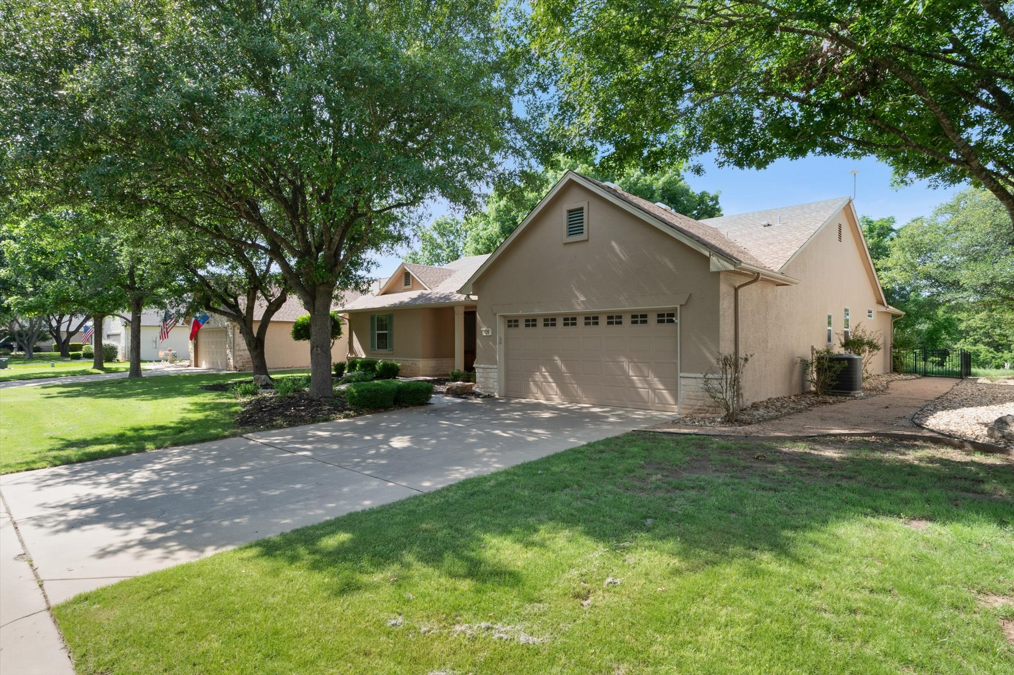 126 Trail Rider Way Georgetown, TX 78633 - Photo 4 of 30 a front view of a house with a yard and garage