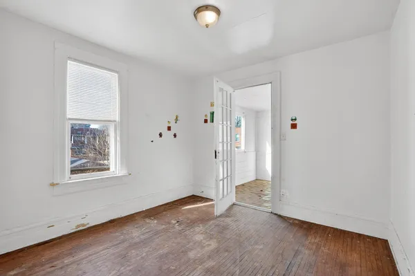a view of a livingroom with wooden floor
