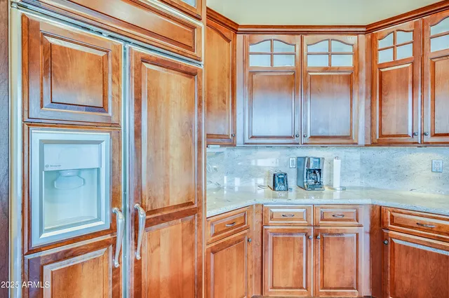 a kitchen with stainless steel appliances granite countertop cabinets and a window