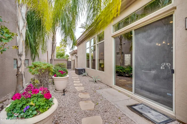 a bunch of flowers in front of house