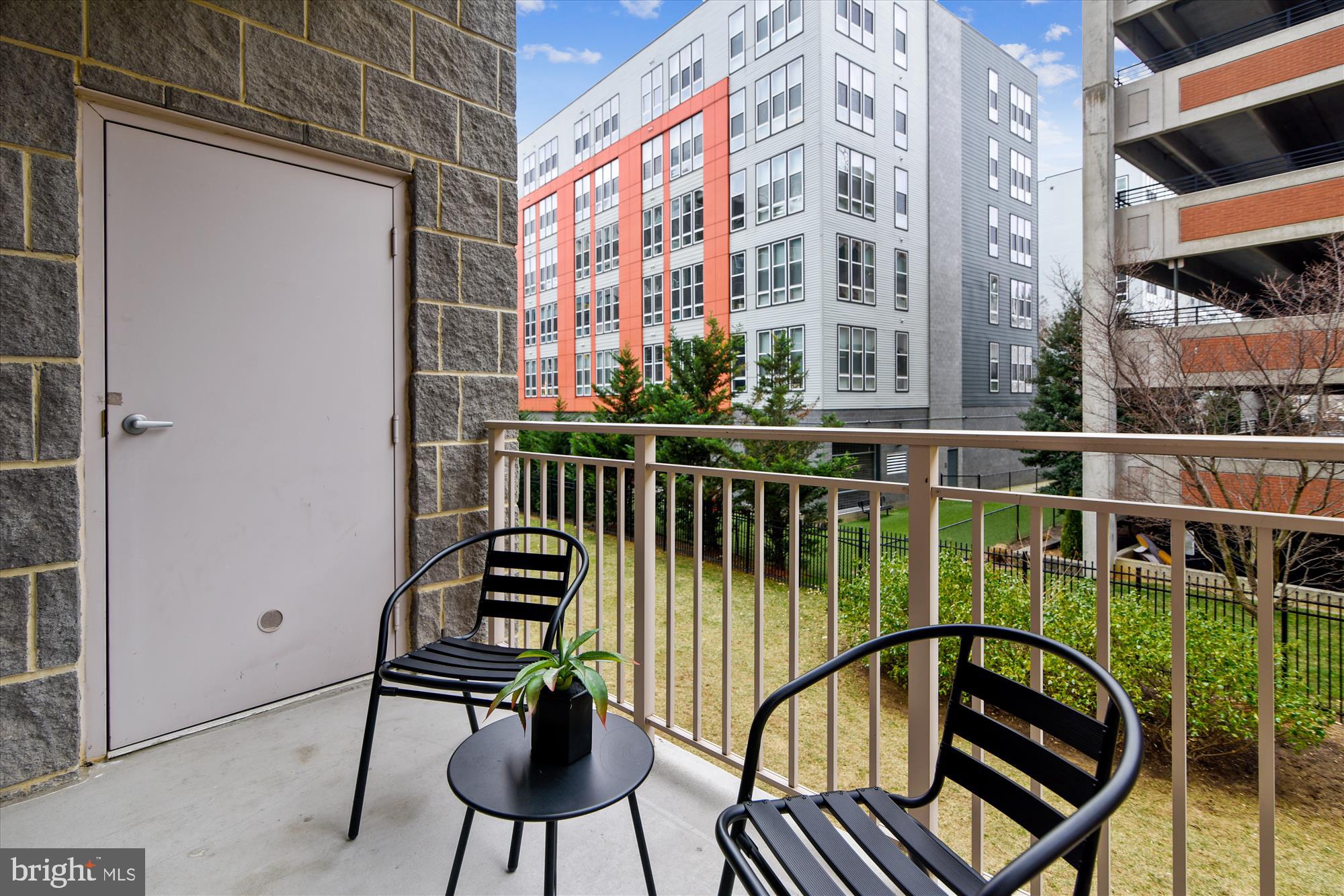 2726 Gallows Road, Unit 113 Vienna, VA 22180 - Photo 10 of 29 a view of a balcony with chairs