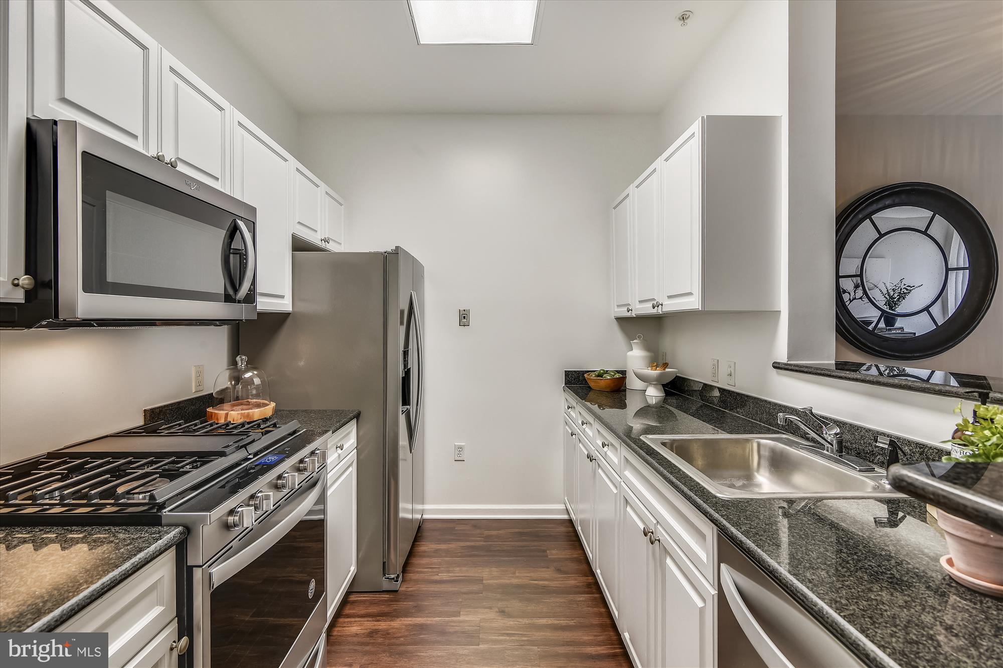 2726 Gallows Road, Unit 113 Vienna, VA 22180 - Photo 6 of 29 a kitchen with a stove and a sink