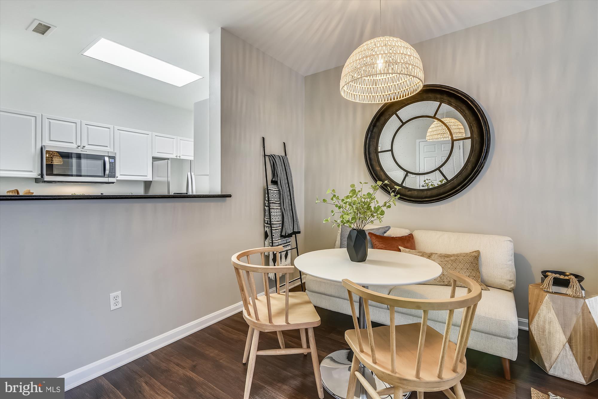 2726 Gallows Road, Unit 113 Vienna, VA 22180 - Photo 8 of 29 a dining room with furniture and a mirror