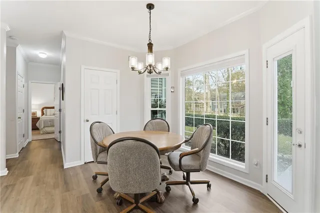 a view of a dining room with furniture window and outside view