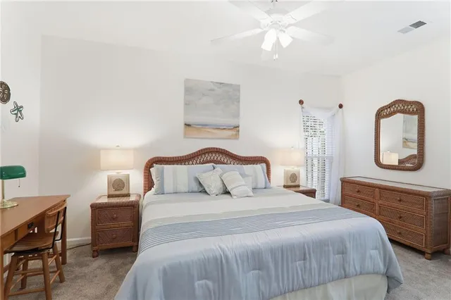 a bathroom with a sink vanity and tub