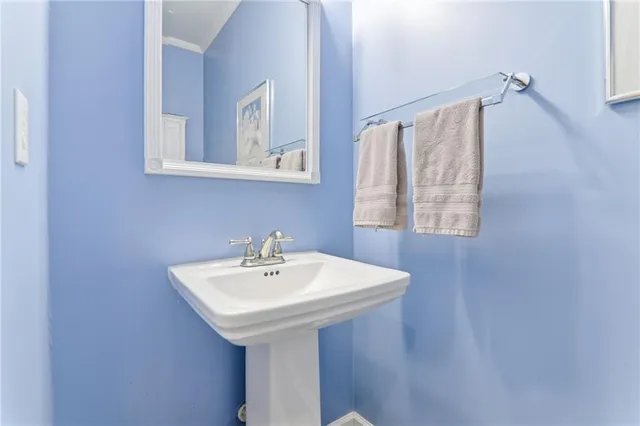 a view of a hallway with a livingroom and entryway