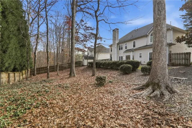 a backyard of a house with lots of green space