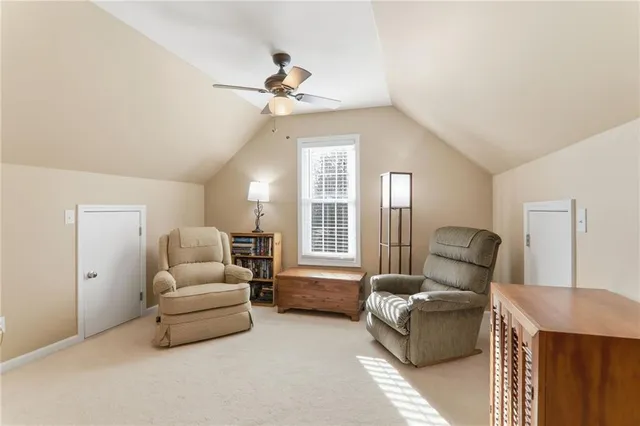a bathroom with a granite countertop tub a double vanity sink and mirror