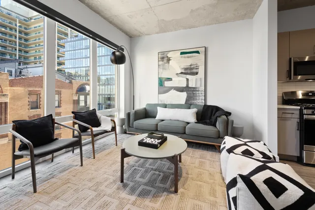 a living room with furniture and a window