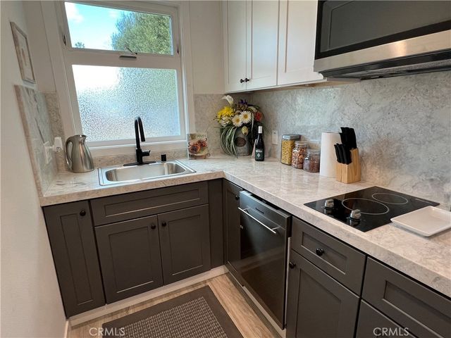 a kitchen with a sink and cabinets