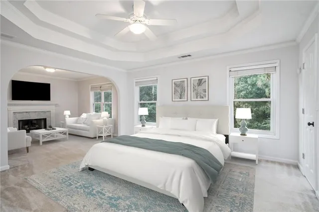 a spacious bedroom with a large bed and a couch