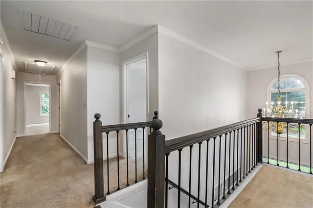 a view of a hallway with windows