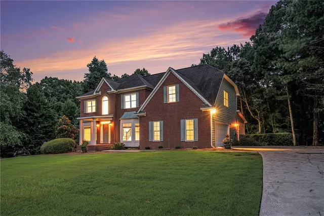 a front view of a house with a yard
