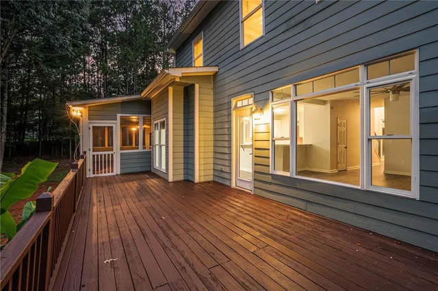 a view of house with backyard and wooden floor