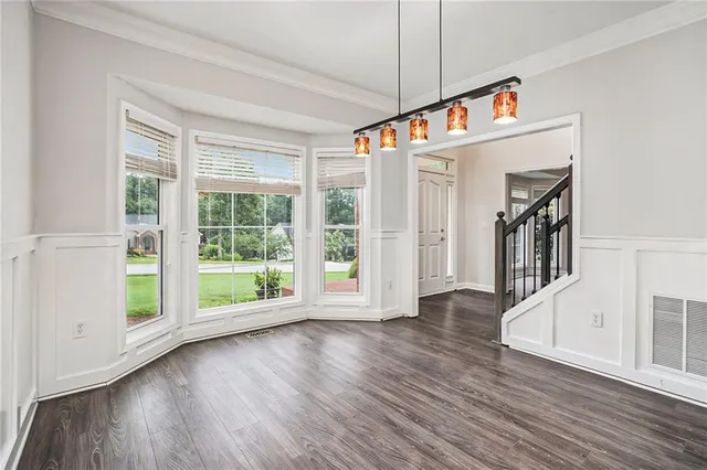 a view of an entryway with wooden floor