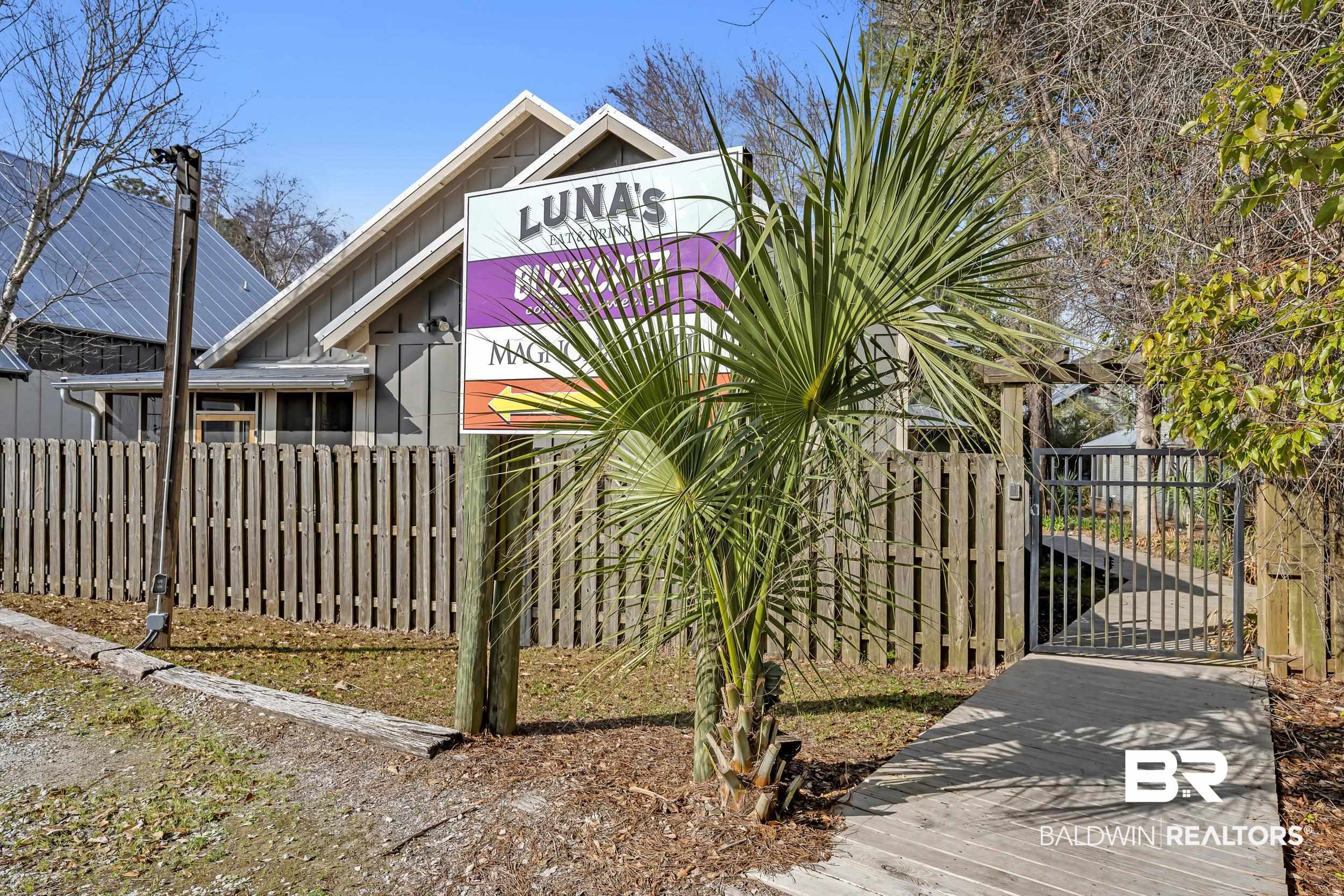 25773 Canal Road, Unit 32 Orange Beach, AL 36561 - Photo 32 of 35 Gate with a fenced front yard