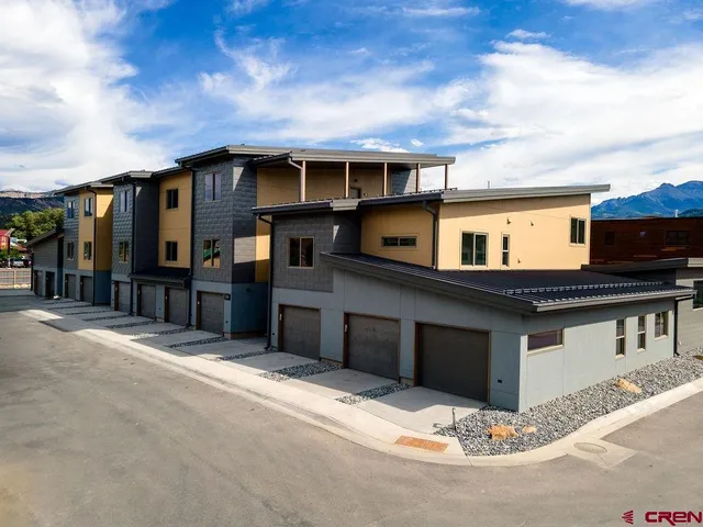 a front view of a house with a garage