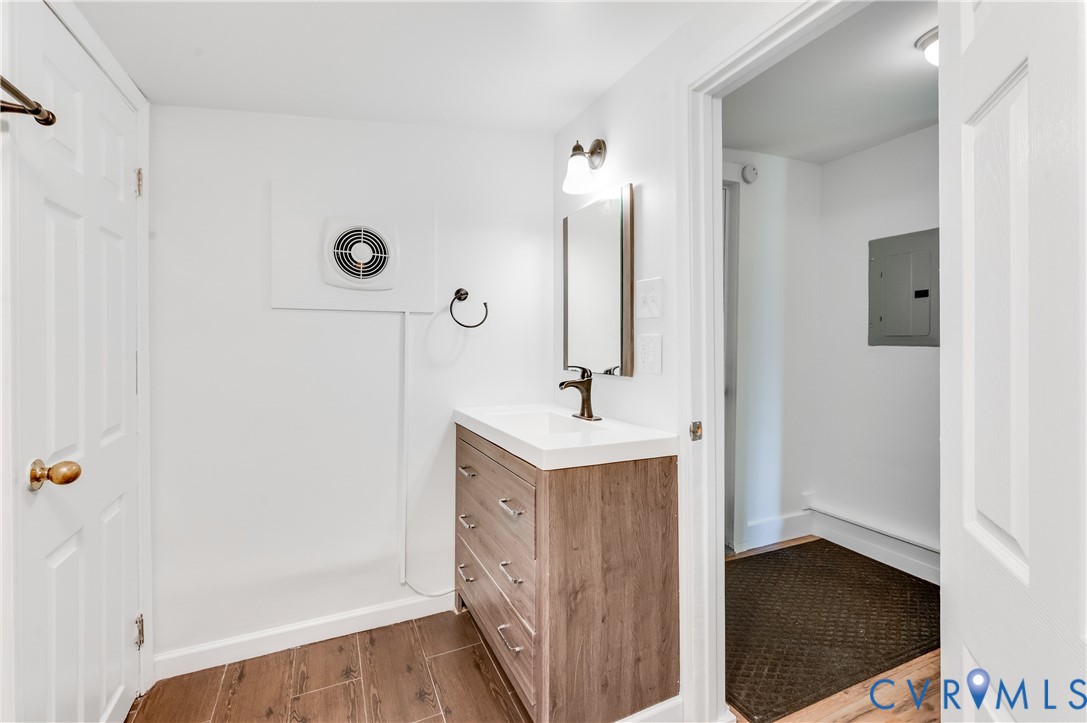 661 CCC Road Crewe, VA 23930 - Photo 25 of 38 Bathroom vanity featuring a wood-look cabinet with