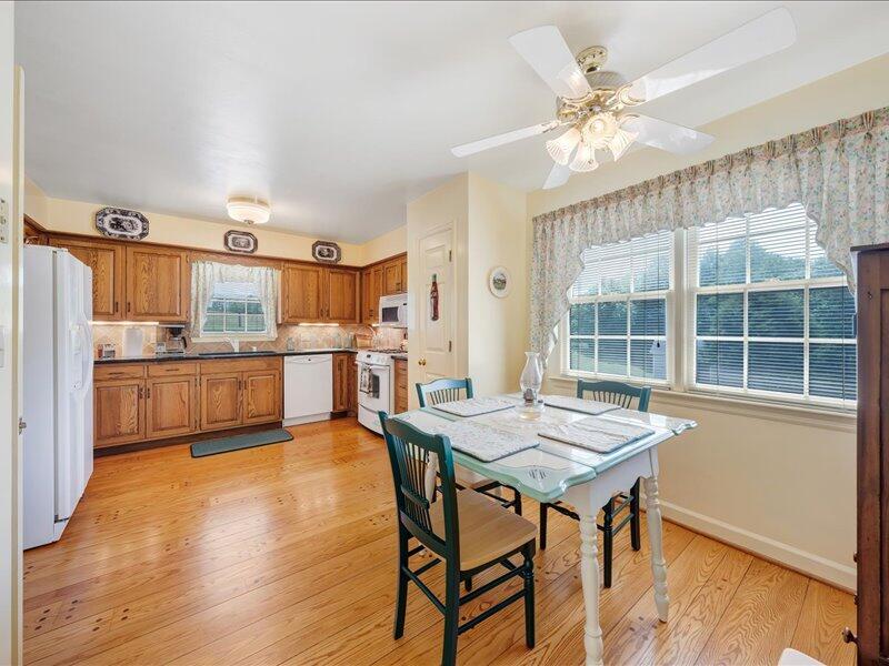 1091 Cool Rock Road Vinton, VA 24179 - Photo 12 of 44 a open kitchen with a table and chairs in it