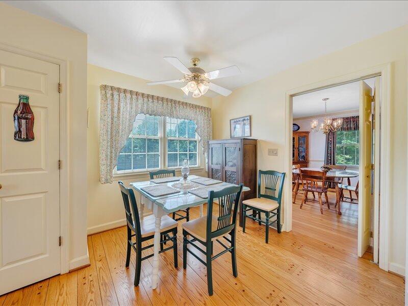 1091 Cool Rock Road Vinton, VA 24179 - Photo 15 of 44 a view of a dining room with furniture window and wooden floor