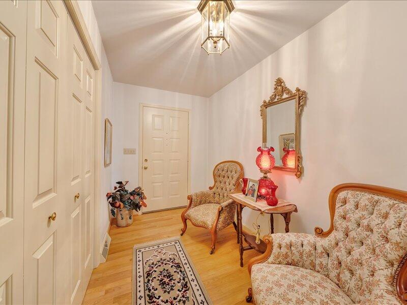 1091 Cool Rock Road Vinton, VA 24179 - Photo 19 of 44 a bedroom with furniture and a chandelier