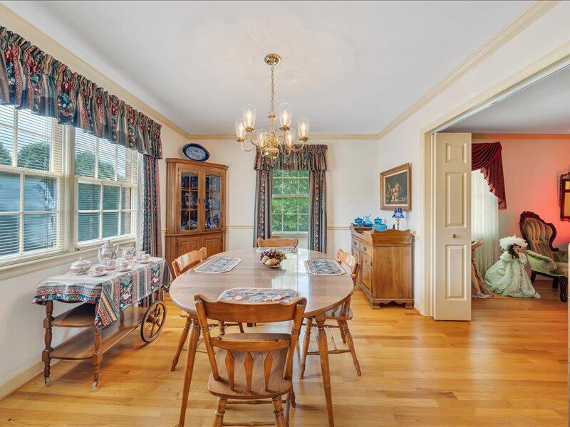 1091 Cool Rock Road Vinton, VA 24179 - Photo 20 of 44 a view of a dining room with furniture window and wooden floor