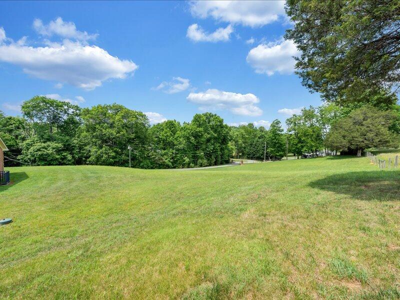1091 Cool Rock Road Vinton, VA 24179 - Photo 2 of 44 a view of a big yard with swimming pool and green space