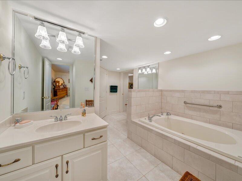 1091 Cool Rock Road Vinton, VA 24179 - Photo 34 of 44 a spacious bathroom with a sink a large mirror and a bathtub