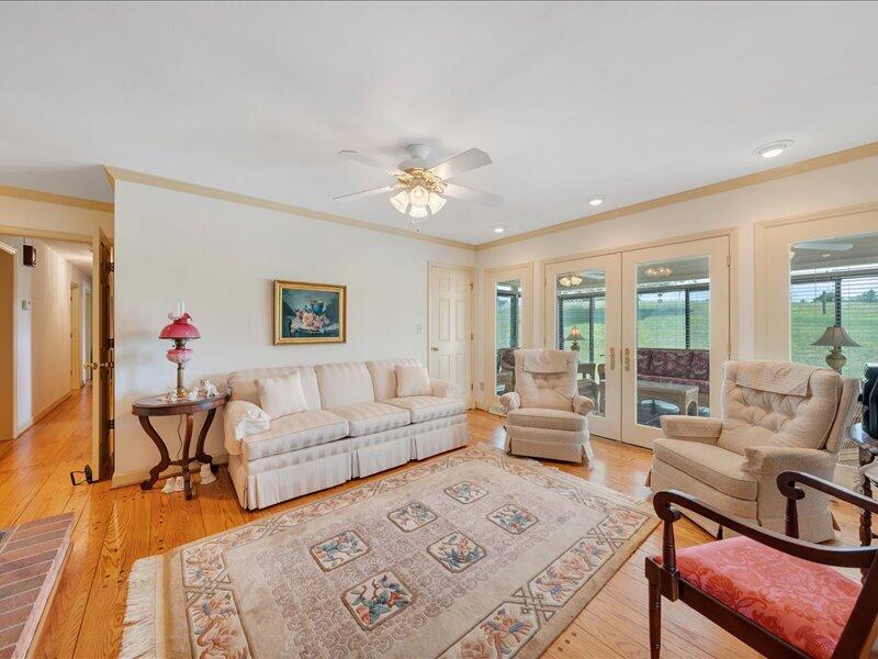 1091 Cool Rock Road Vinton, VA 24179 - Photo 8 of 44 a living room with furniture and a chandelier