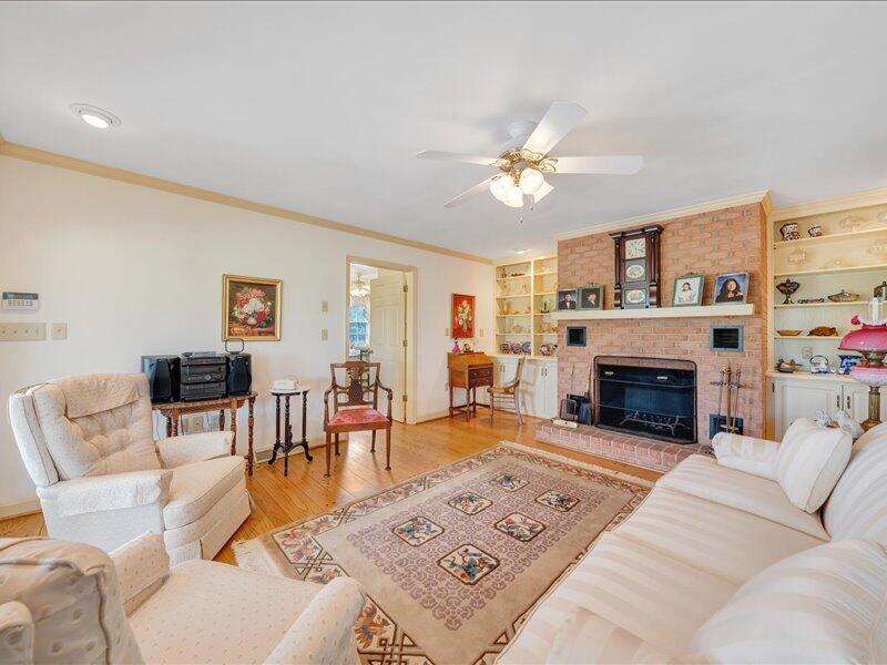 1091 Cool Rock Road Vinton, VA 24179 - Photo 10 of 44 a living room with furniture a fireplace and a table