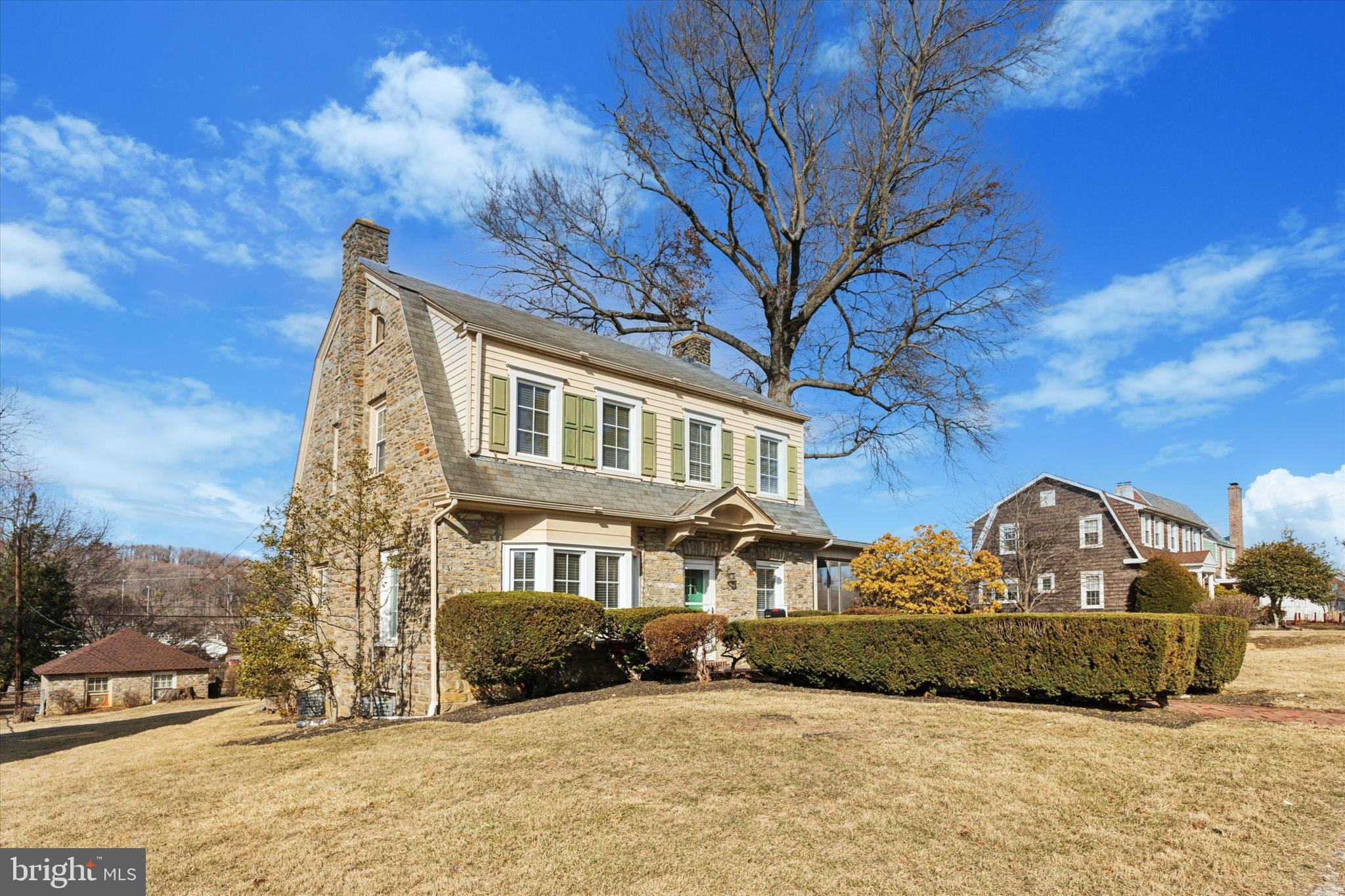 1329 Olive Street Coatesville, PA 19320 - Photo 18 of 35 a view of a white house with a yard covered in snow