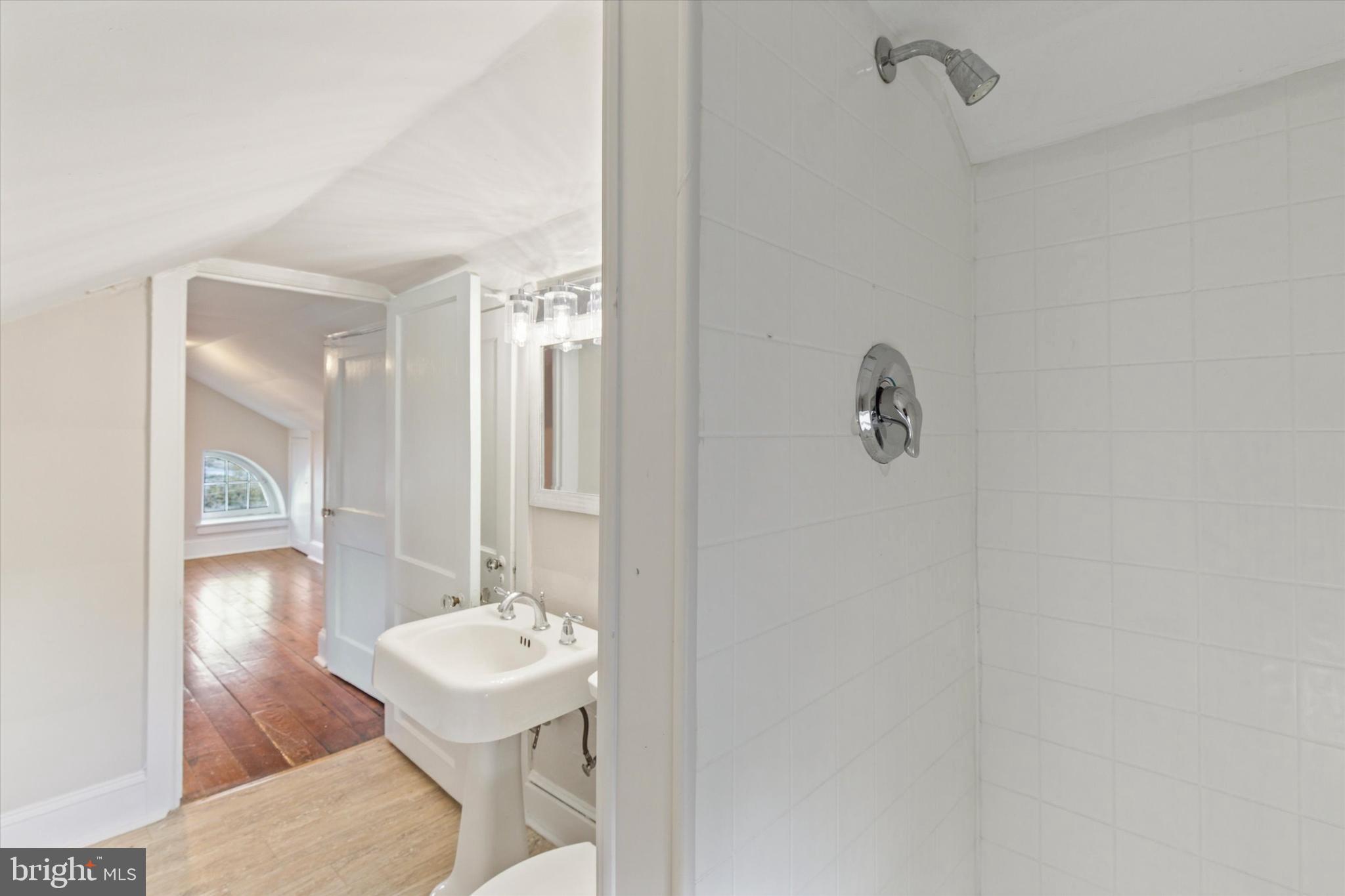 1329 Olive Street Coatesville, PA 19320 - Photo 31 of 35 a bathroom with a sink and a mirror