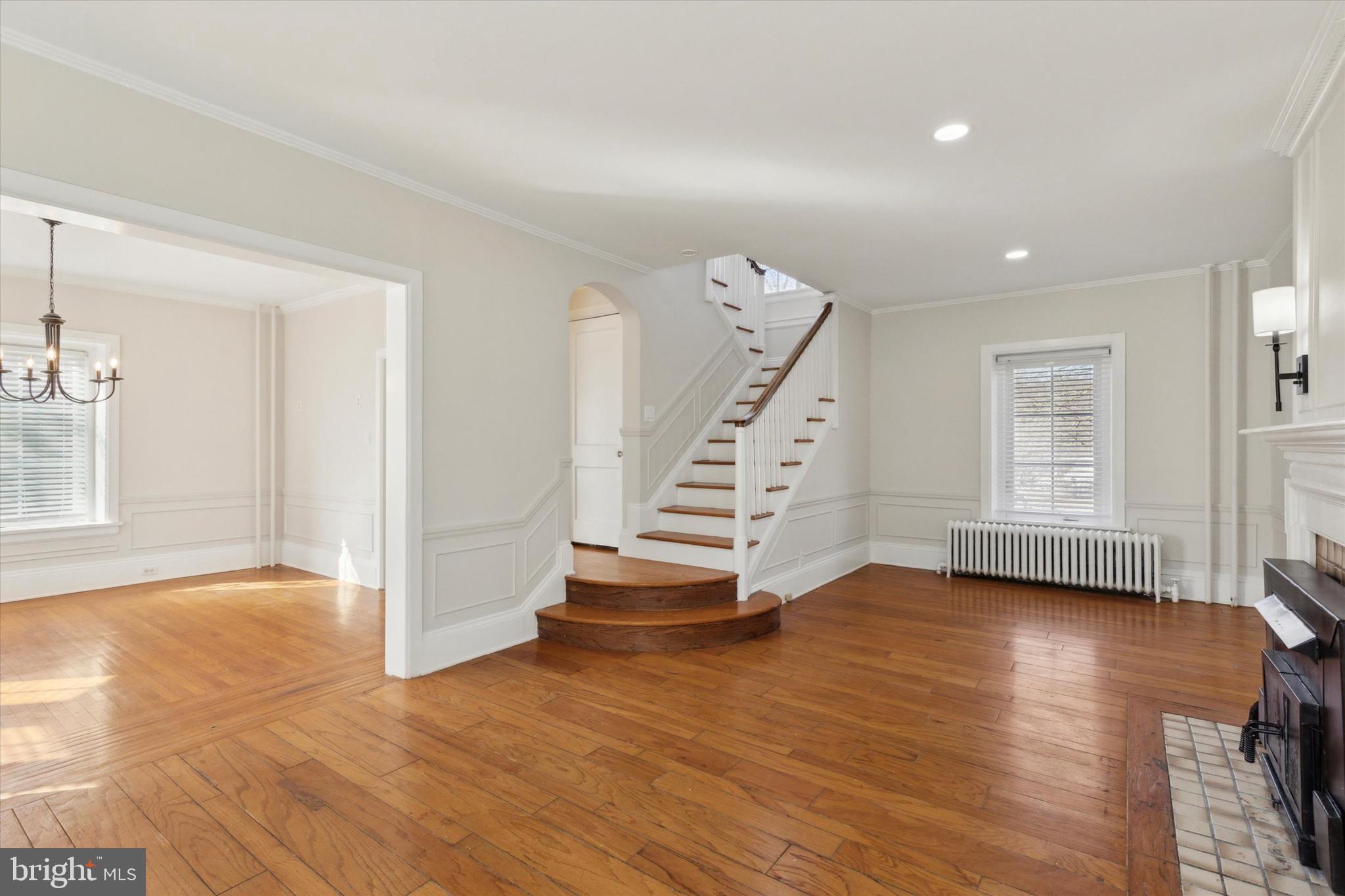 1329 Olive Street Coatesville, PA 19320 - Photo 4 of 35 an empty room with wooden floor and windows