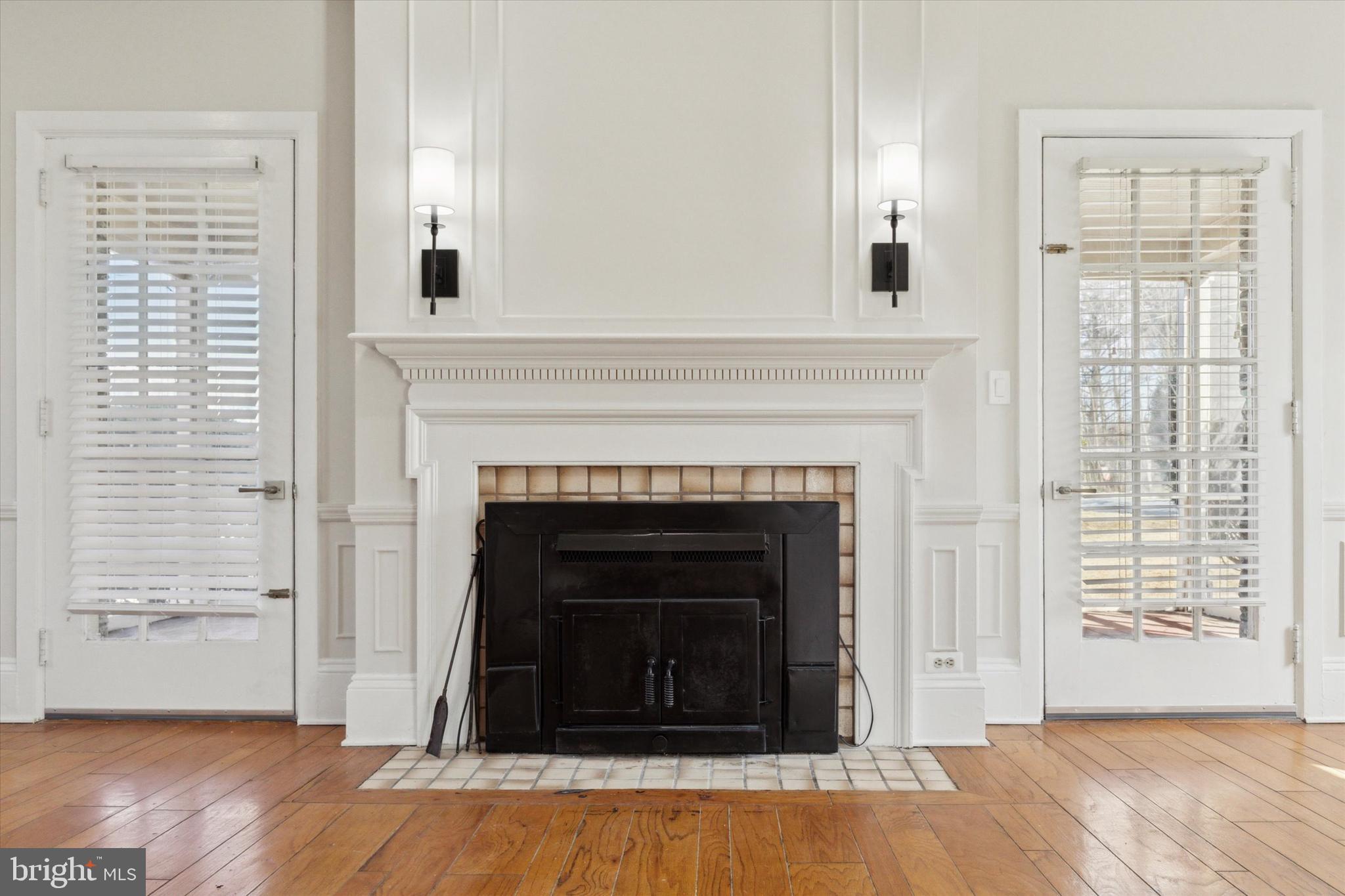 1329 Olive Street Coatesville, PA 19320 - Photo 7 of 35 a living room with a fireplace with wooden floor