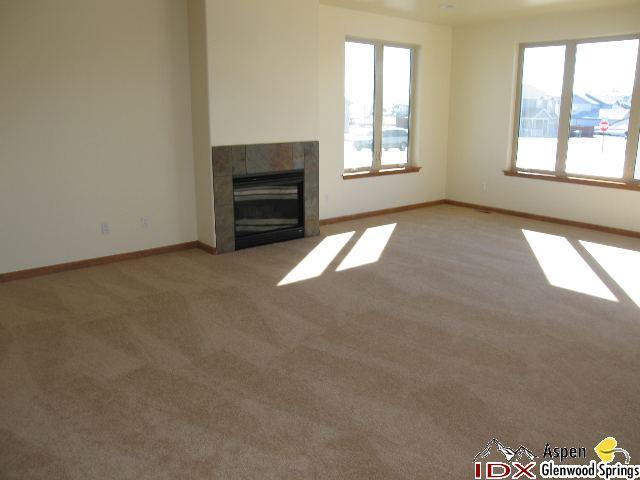 1961 Promontory Circle, Unit LOT 79 Rifle, CO 81650 - Photo 3 of 6 an empty room with windows