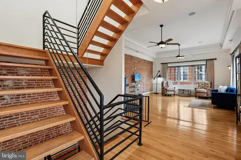 a livingroom with furniture and wooden floor