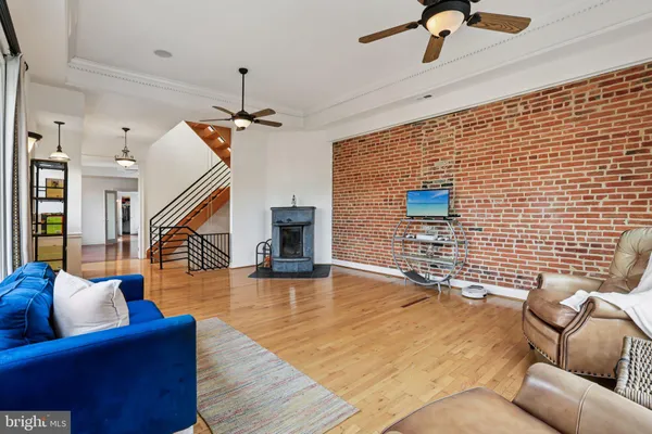 a view of a livingroom with furniture and a fireplace