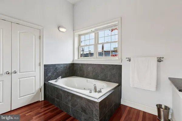 a bathroom with a glass shower door and a glass door