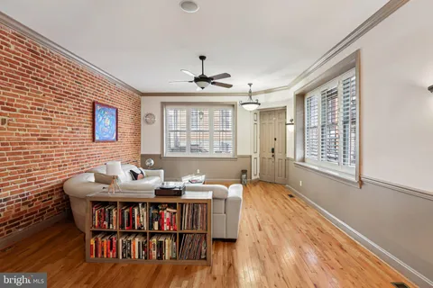 a workspace with furniture window and wooden floor