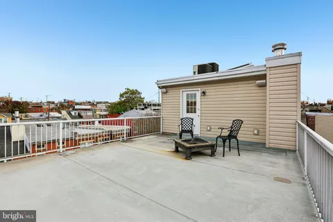 a room with gym equipment and view of living room