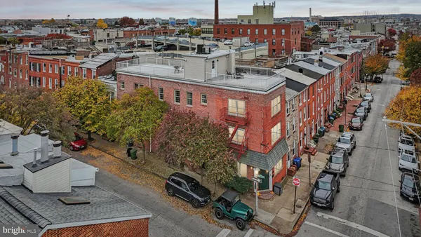 a view of a cars parked on the side of a street
