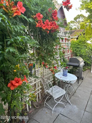 a view of hall way with furniture and toys