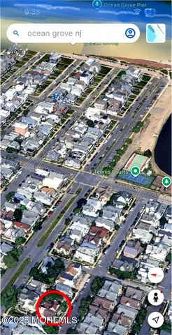 a front view of a house with plants